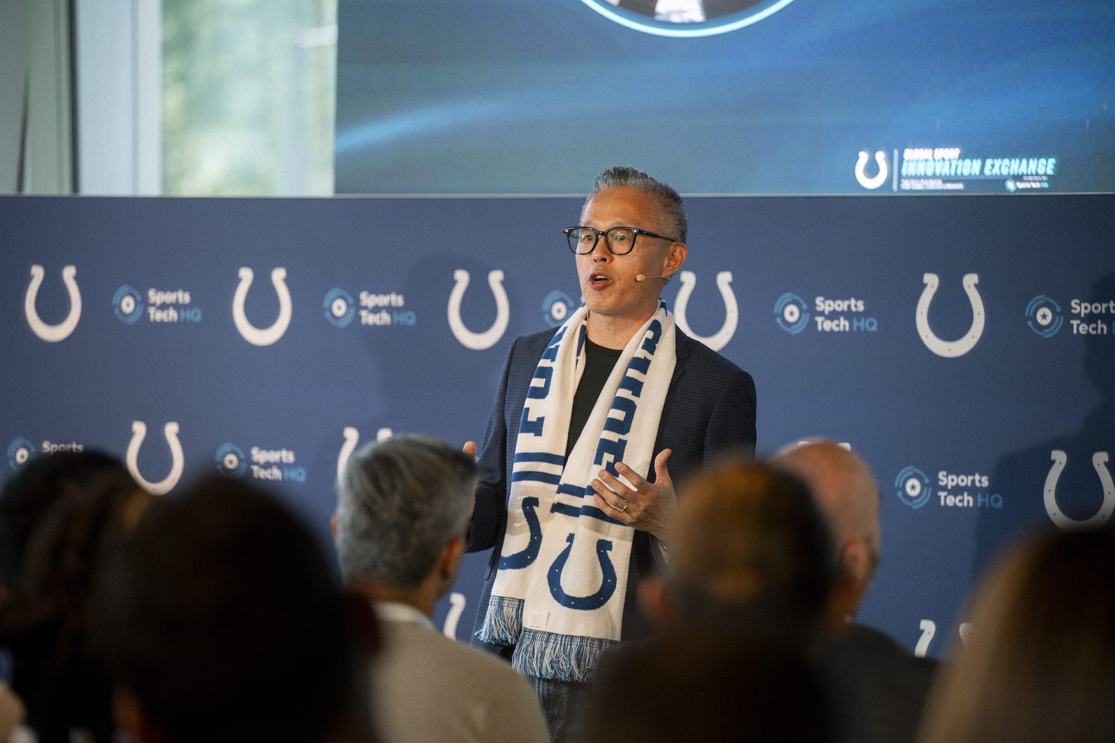 Charlie Shin of the Indianapolis Colts welcomes attendees to the Global Sport Innovation Exchange in London